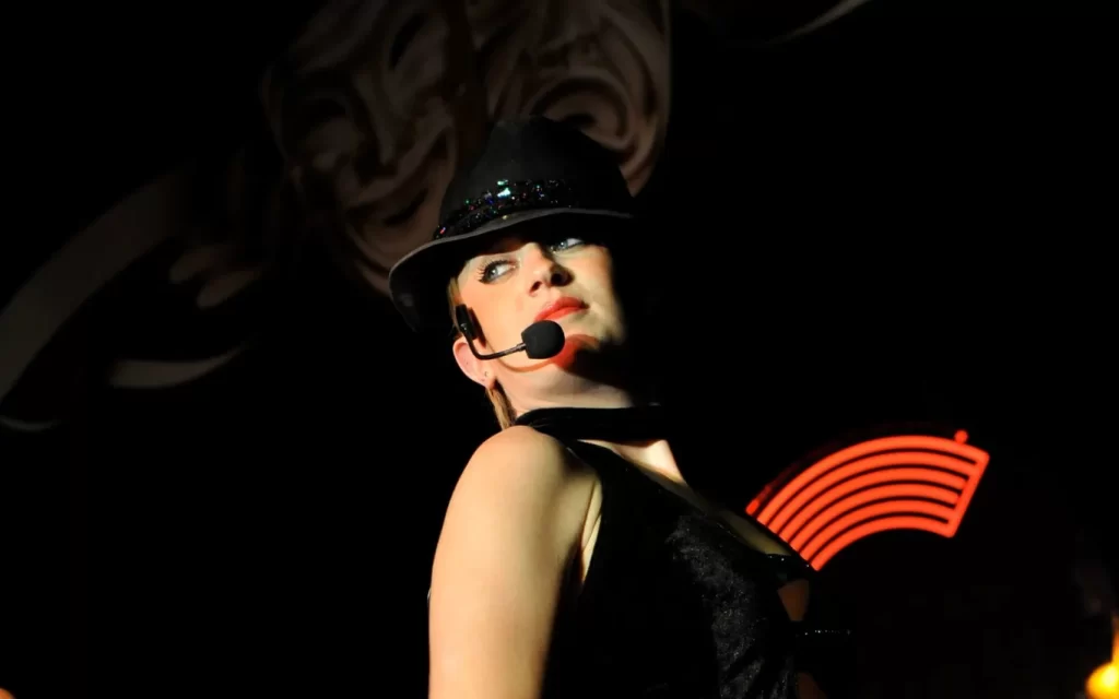 Jo performing on stage as a singer